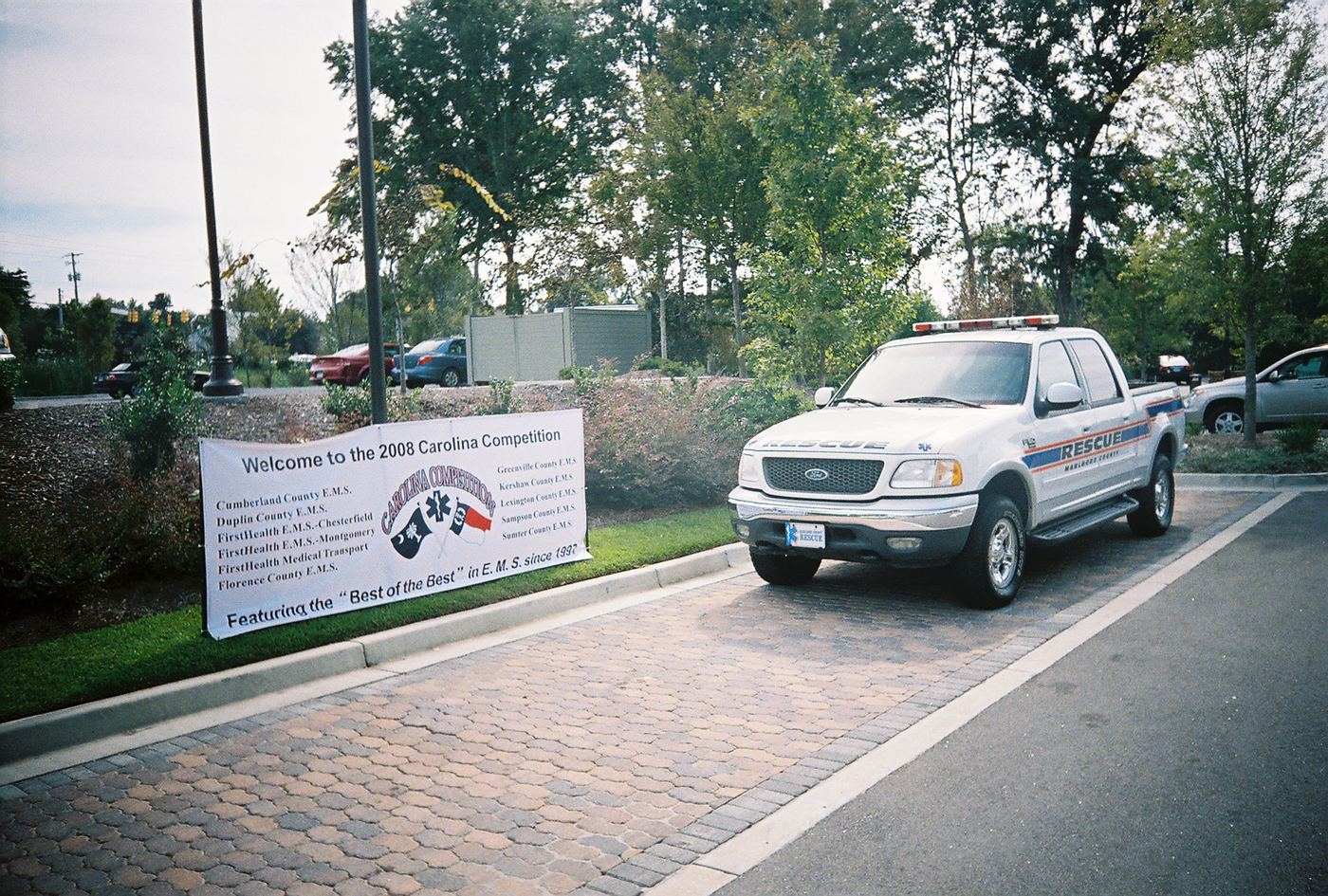 A welcome banner for the 2008 Carolina Competition beside a rescue truck