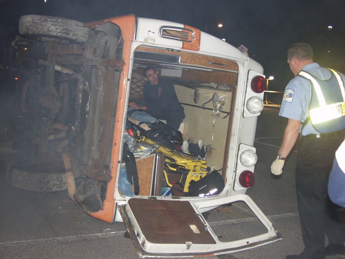 A night scenario built around an overturned ambulance
