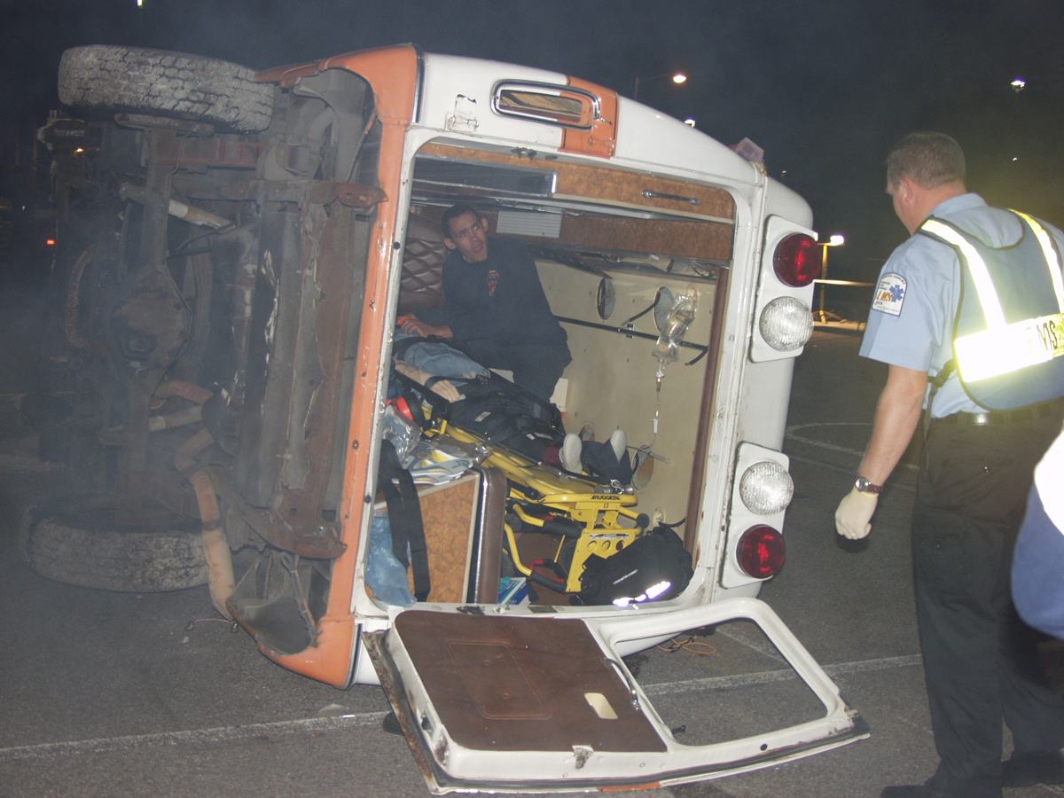 A night scenario built around an overturned ambulance